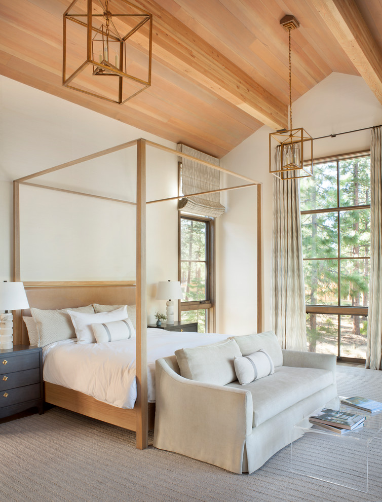 Inspiration for a large rustic master bedroom in Sacramento with white walls and feature lighting.