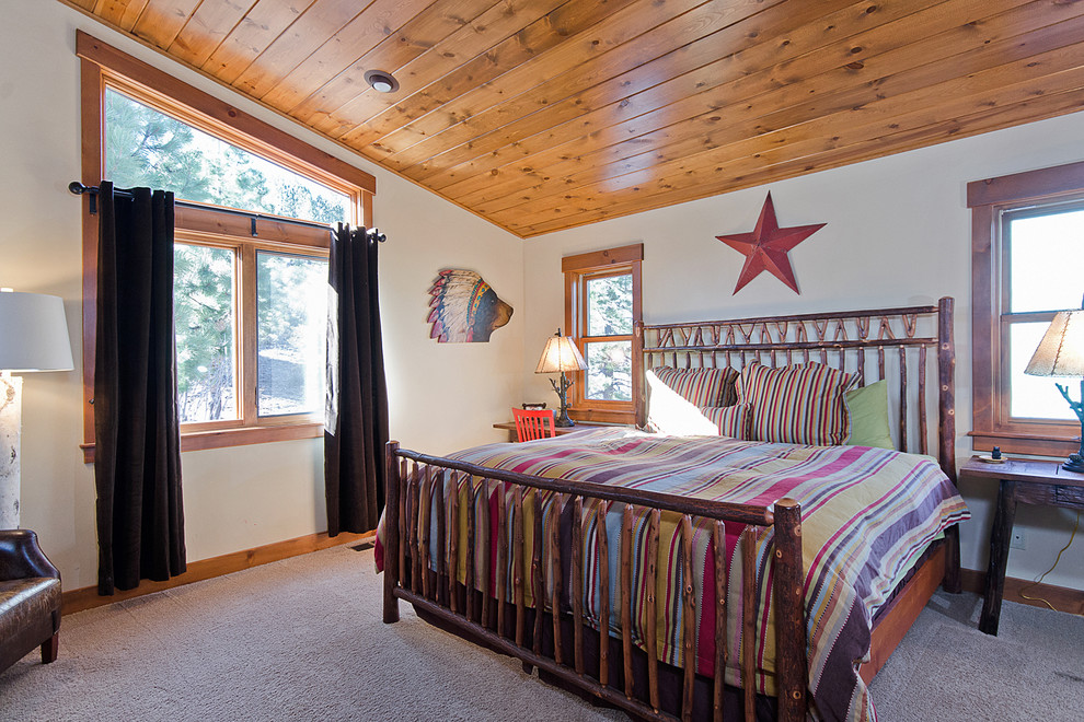 Example of a mountain style carpeted bedroom design in Other with white walls and no fireplace
