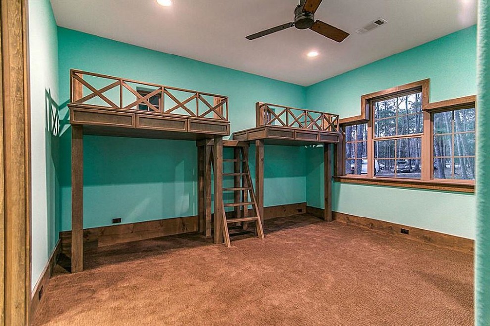 Medium sized rustic guest bedroom in Houston with blue walls and carpet.