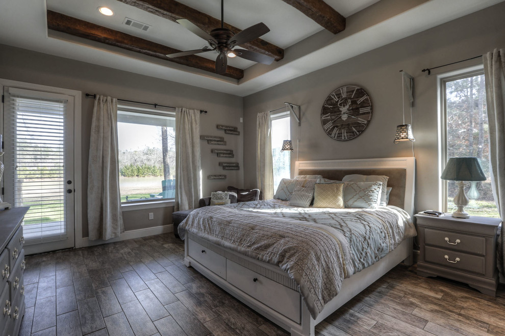 Large cottage master brown floor and ceramic tile bedroom photo in Houston with beige walls and no fireplace