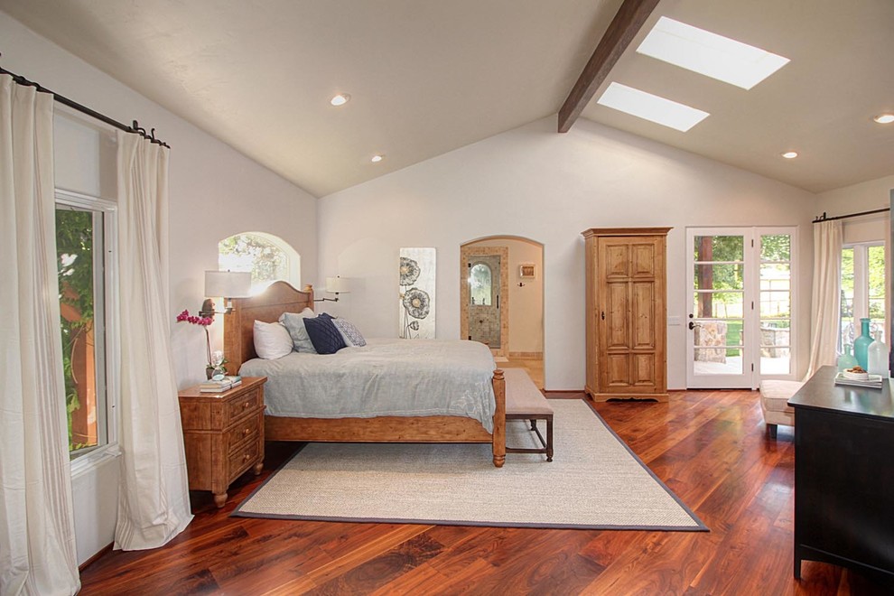 Example of a mountain style master medium tone wood floor bedroom design in Sacramento