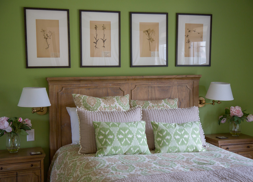 This is an example of a medium sized classic guest bedroom in Los Angeles with green walls, carpet and no fireplace.