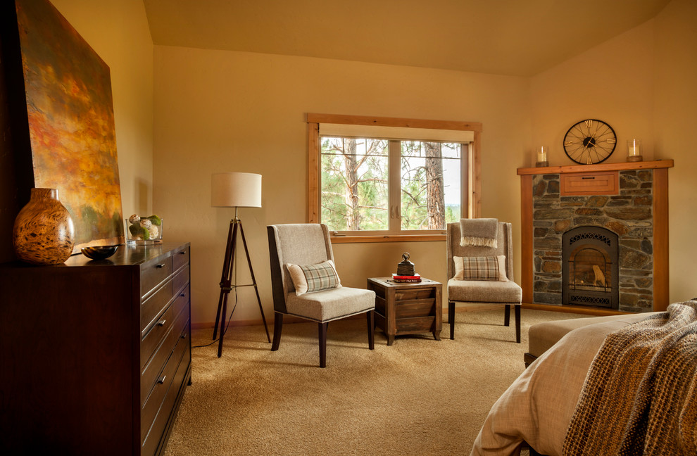 Example of a mid-sized mountain style master carpeted and brown floor bedroom design in Portland with a corner fireplace and a wood fireplace surround