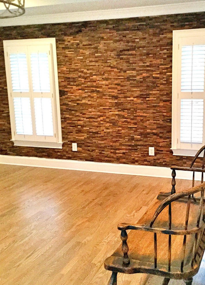 Medium sized rustic master bedroom in Atlanta with grey walls and light hardwood flooring.