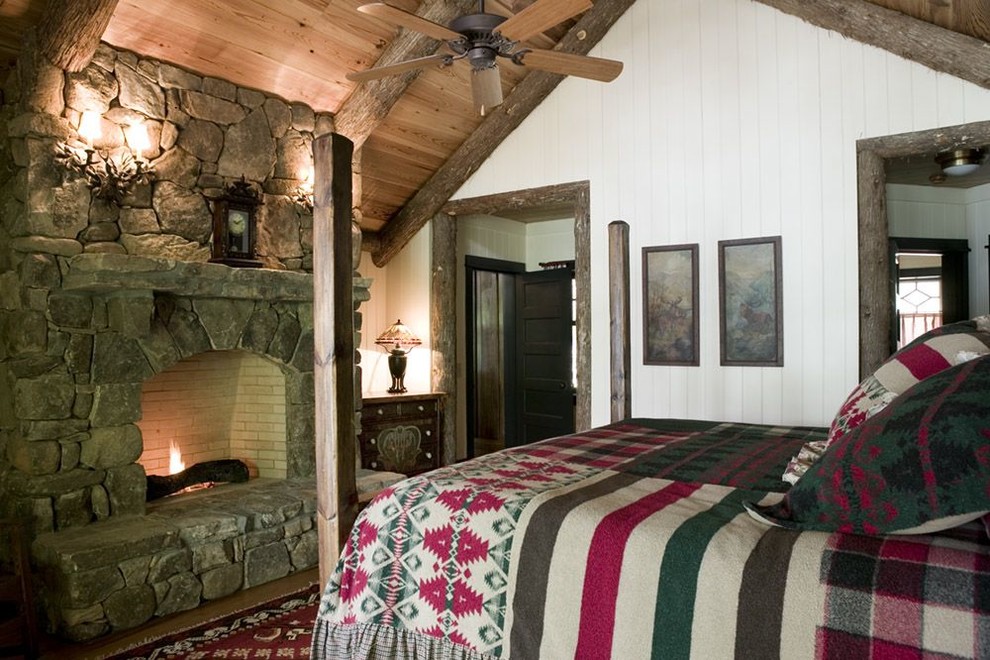Modelo de dormitorio rural con todas las chimeneas y marco de chimenea de piedra