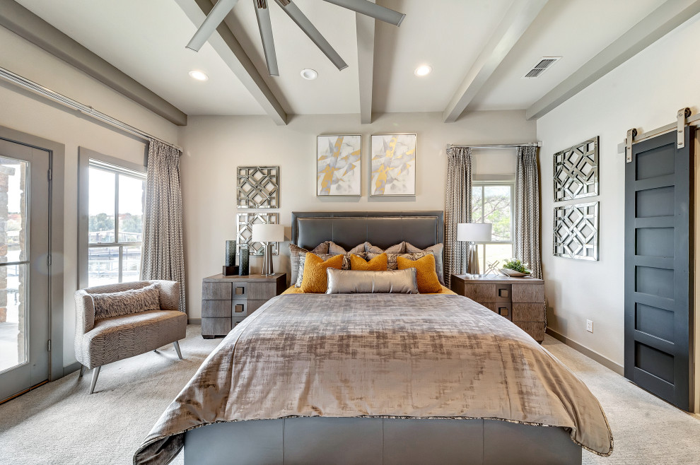 Large contemporary master bedroom in Dallas with grey walls, carpet and grey floors.