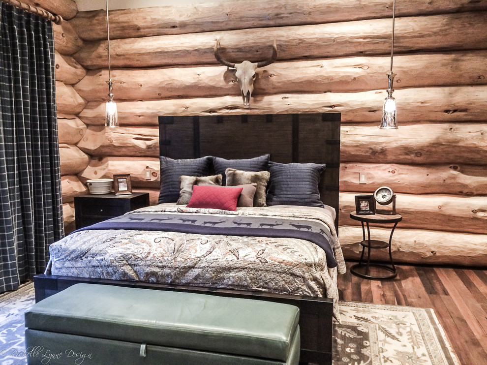 Design ideas for a large rustic master bedroom in Calgary.