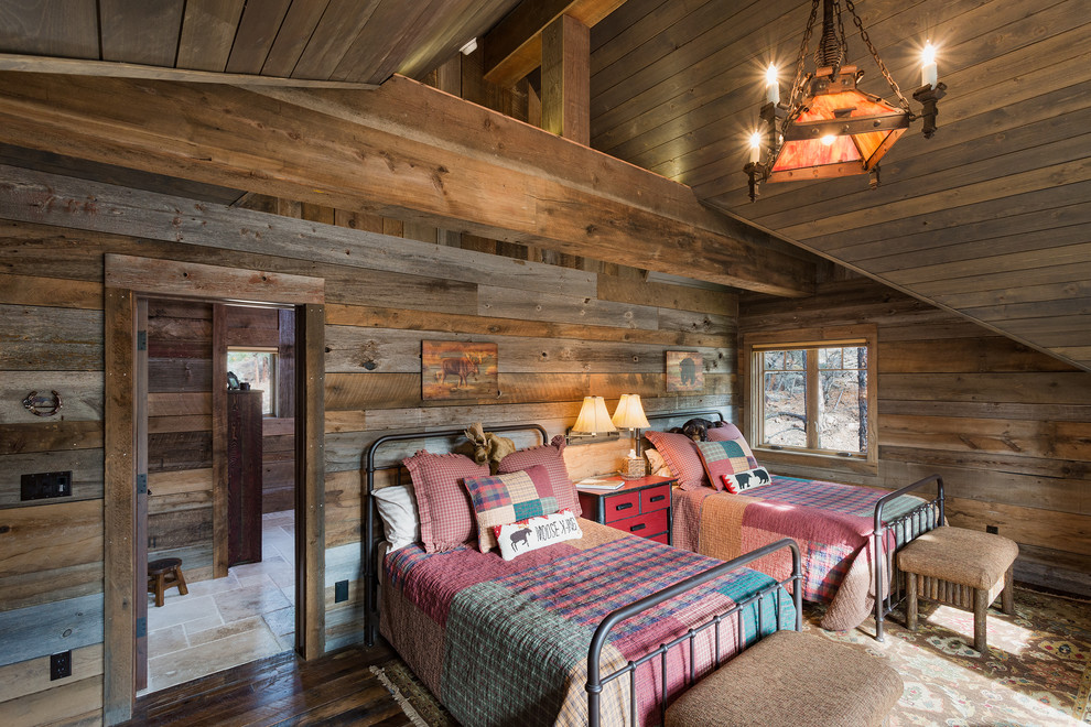 Design ideas for a rustic guest bedroom in Albuquerque with brown walls and dark hardwood flooring.