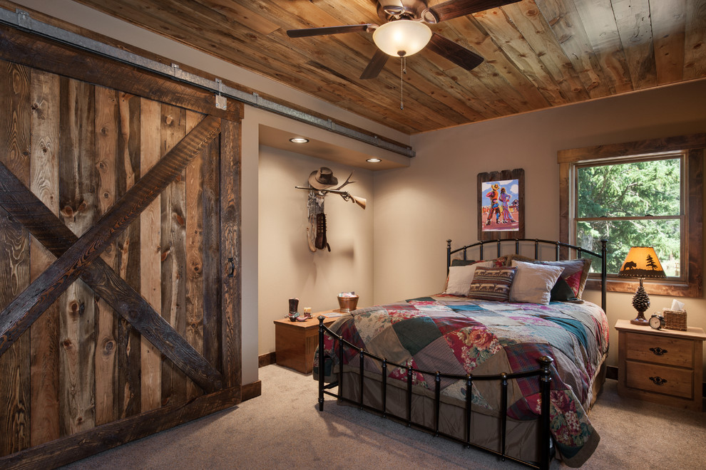 Rustic guest bedroom in Boise with beige walls and carpet.
