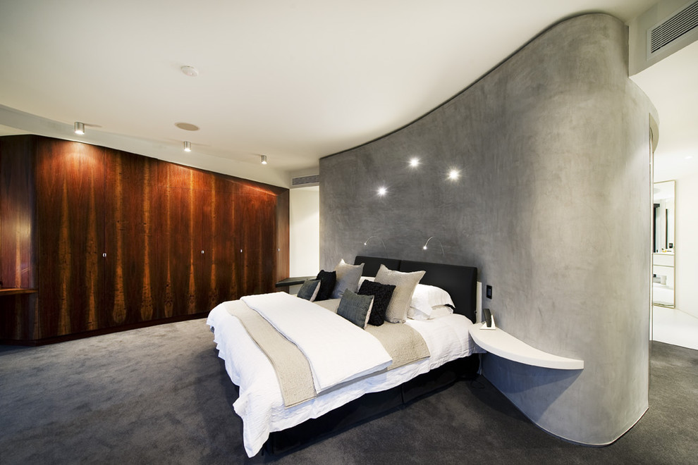 Ejemplo de dormitorio principal contemporáneo sin chimenea con paredes grises y moqueta