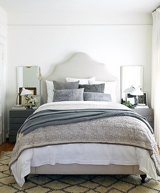 Example of a mid-sized transitional master medium tone wood floor bedroom design in San Francisco with white walls and no fireplace
