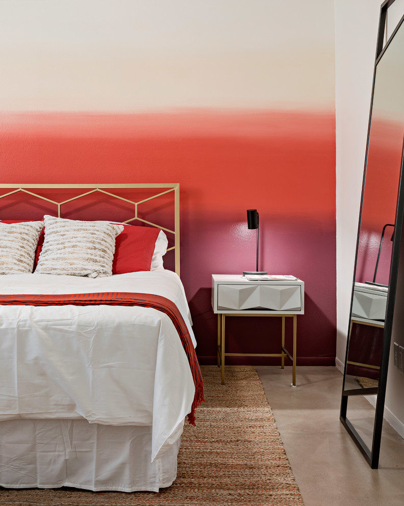 Modelo de dormitorio actual con paredes multicolor, suelo de cemento y suelo gris