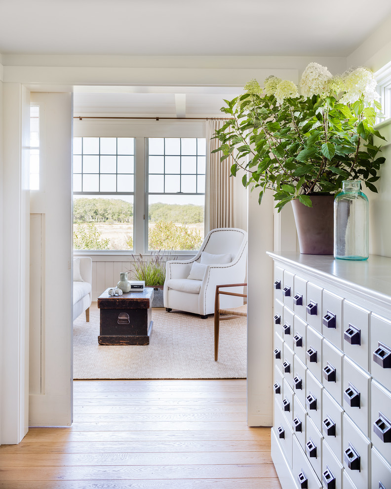 Bedroom - transitional master light wood floor bedroom idea in Boston with white walls