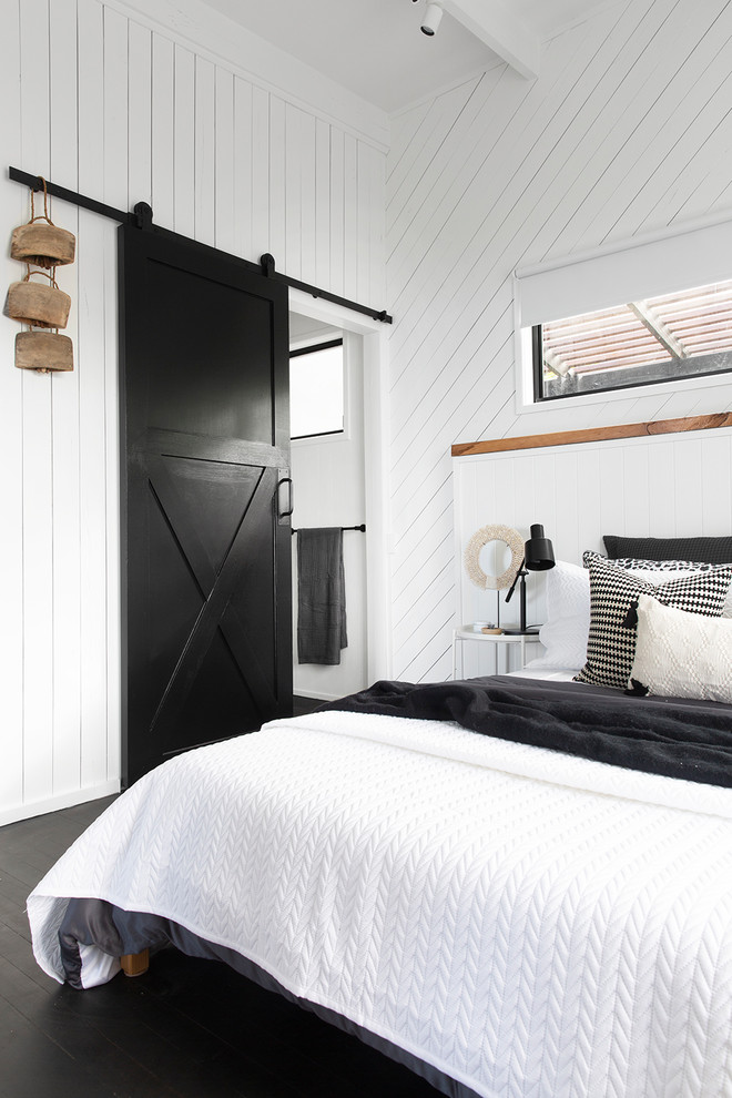 Example of a beach style bedroom design in Sunshine Coast
