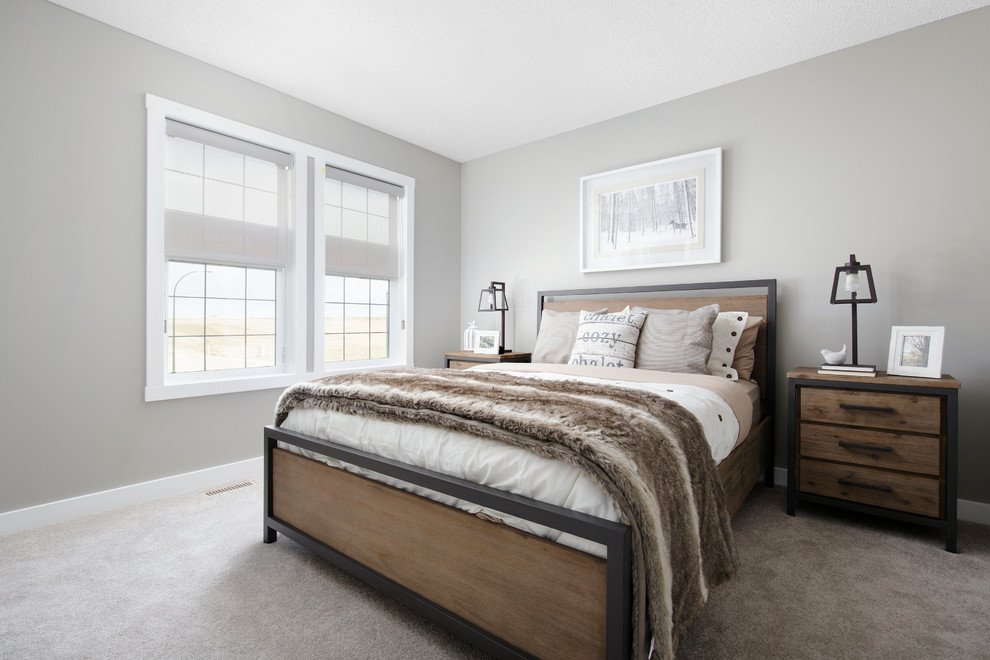This is an example of a medium sized country master bedroom in Calgary with grey walls and carpet.