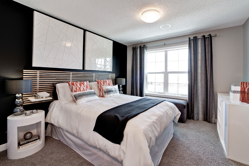 Contemporary bedroom in Calgary with carpet.