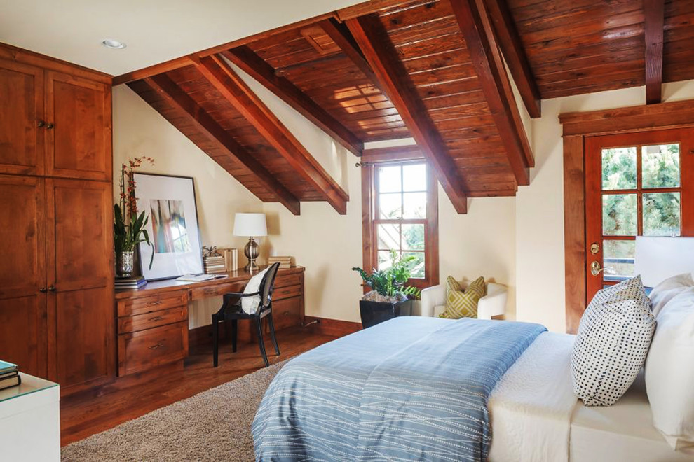 Example of a classic medium tone wood floor and brown floor bedroom design in San Francisco with beige walls
