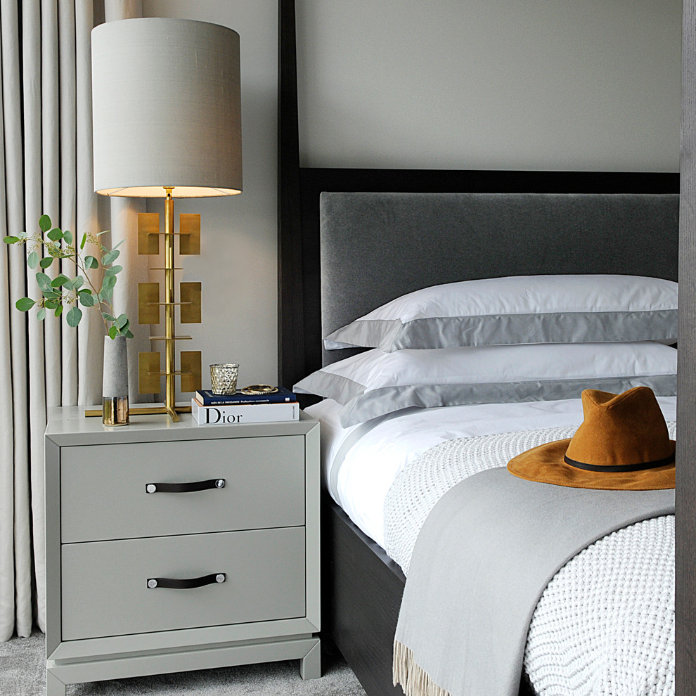 This is an example of a medium sized nautical bedroom in London.