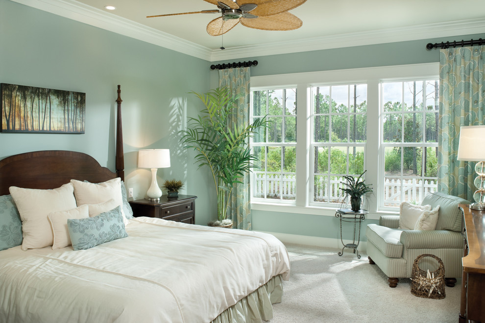 Bedroom - tropical carpeted bedroom idea in Tampa with blue walls