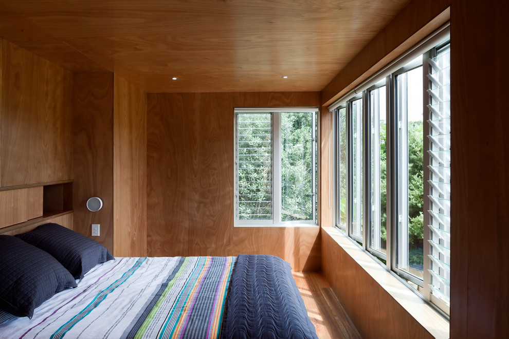 Example of a trendy bedroom design in Auckland