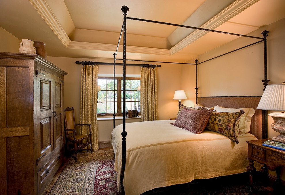 Tuscan guest bedroom photo in Santa Barbara with beige walls