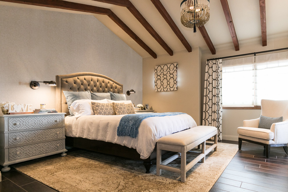 Photo of a mediterranean master bedroom with grey walls, brown floors, porcelain flooring, a standard fireplace and a stone fireplace surround.