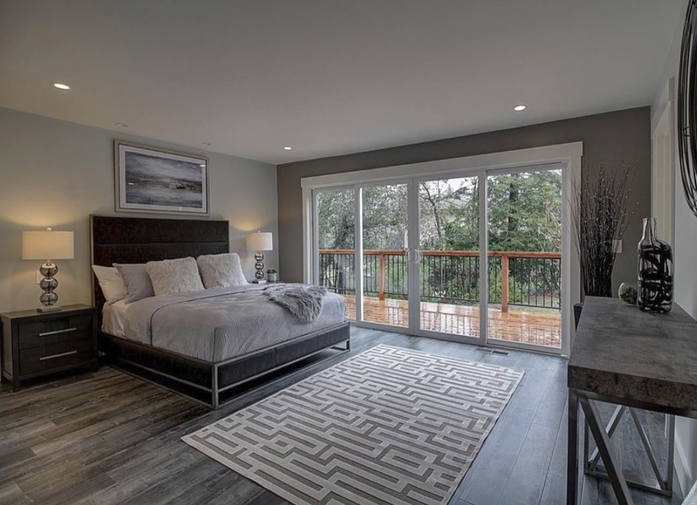 Bedroom - large contemporary master medium tone wood floor and gray floor bedroom idea in San Francisco with gray walls and no fireplace