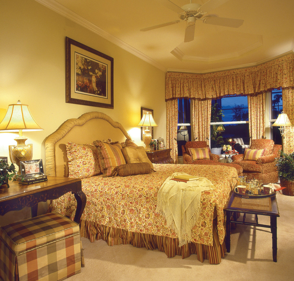 Example of a large cottage guest carpeted bedroom design in Miami with yellow walls and no fireplace