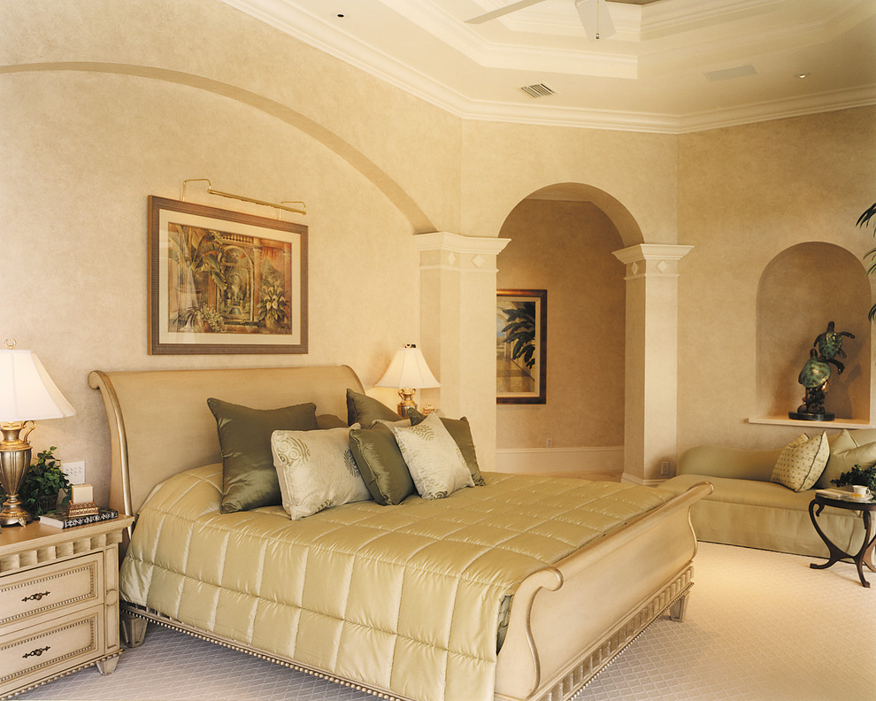 Expansive mediterranean master bedroom in Miami with beige walls, carpet and no fireplace.