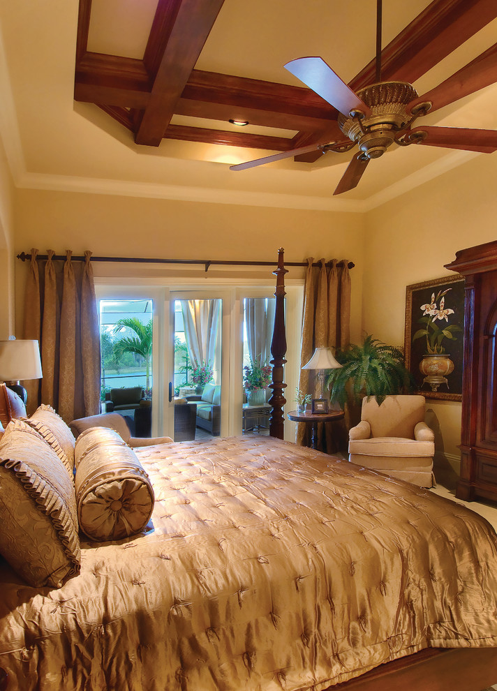 Bedroom - large mediterranean master bedroom idea in Miami with beige walls and no fireplace