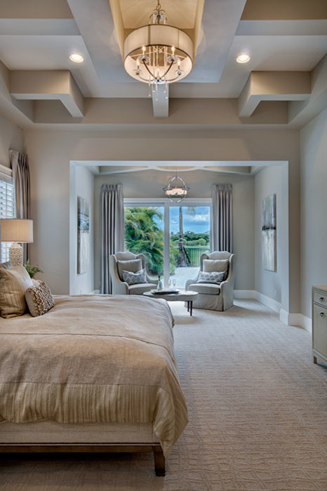 Inspiration for a large mediterranean master bedroom in Miami with grey walls, carpet and no fireplace.