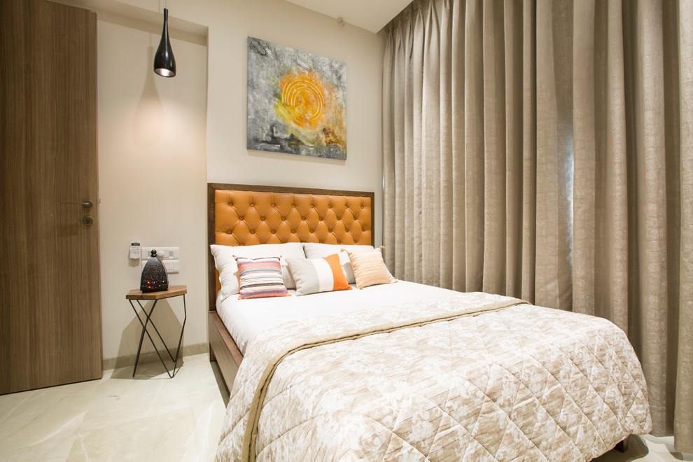 Example of a small trendy guest beige floor bedroom design in Mumbai with beige walls