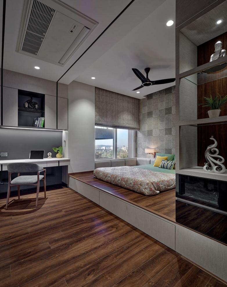 Photo of a large contemporary master and grey and brown bedroom in Pune with grey walls and brown floors.