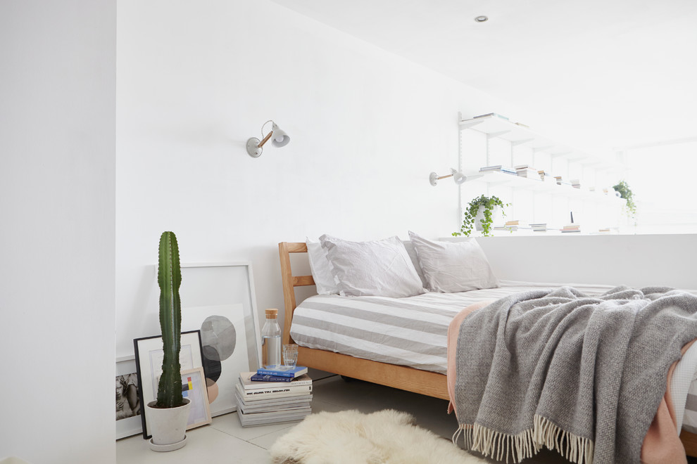 Inspiration for a scandi bedroom in London with white walls and no fireplace.