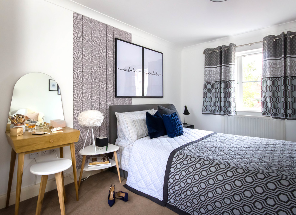 Photo of a large scandi master bedroom in Berkshire with white walls, carpet and brown floors.