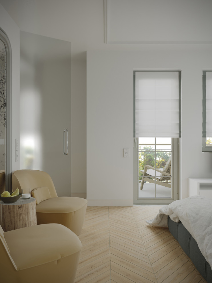 Ejemplo de dormitorio principal nórdico grande con paredes blancas y suelo de madera clara