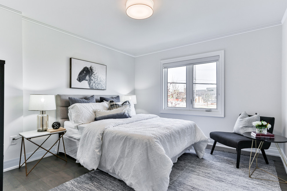 Ejemplo de habitación de invitados escandinava de tamaño medio sin chimenea con paredes blancas, suelo de madera oscura y suelo marrón