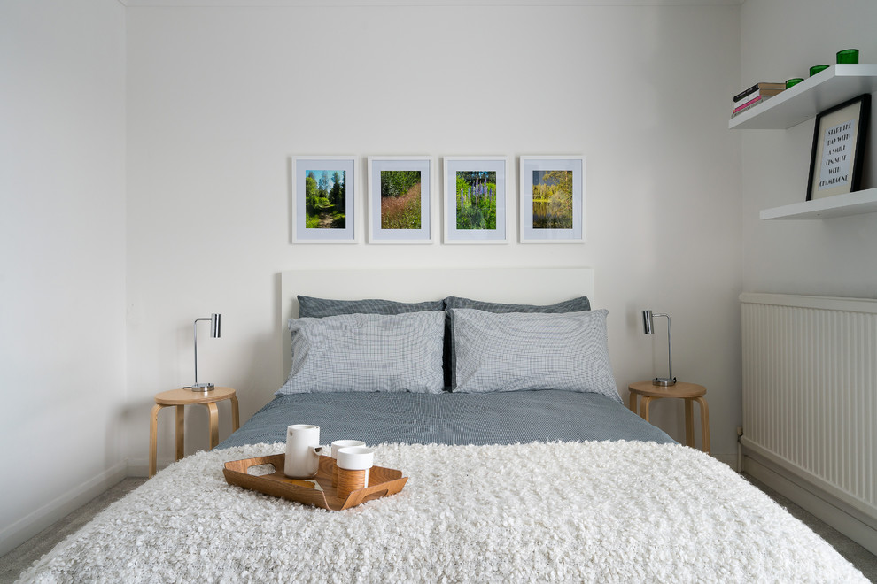 Design ideas for a scandi guest bedroom in Cambridgeshire with white walls.