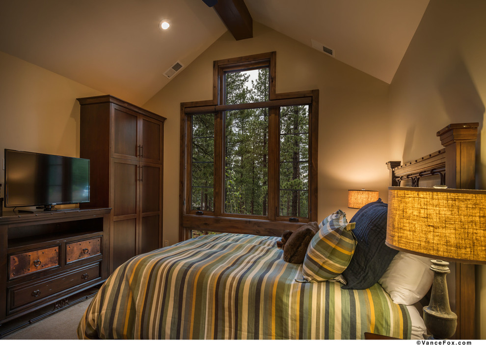Example of a mid-sized mountain style guest carpeted bedroom design in Sacramento with beige walls and no fireplace