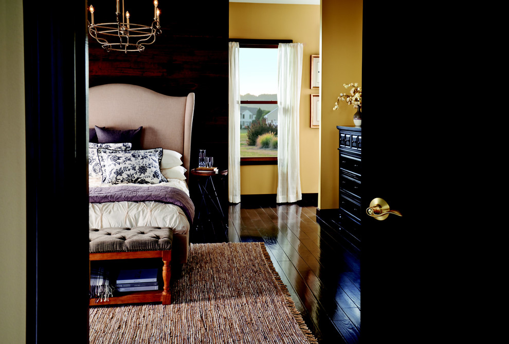 Example of a minimalist dark wood floor bedroom design in Indianapolis with beige walls