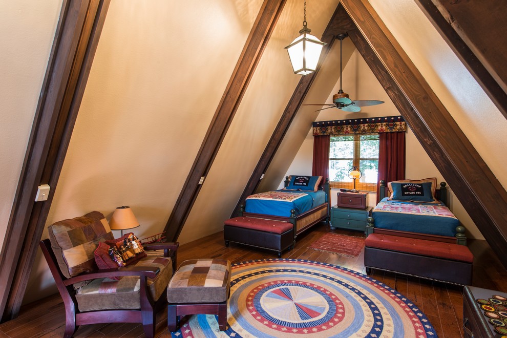 Example of a mid-sized classic loft-style dark wood floor bedroom design in Other with beige walls