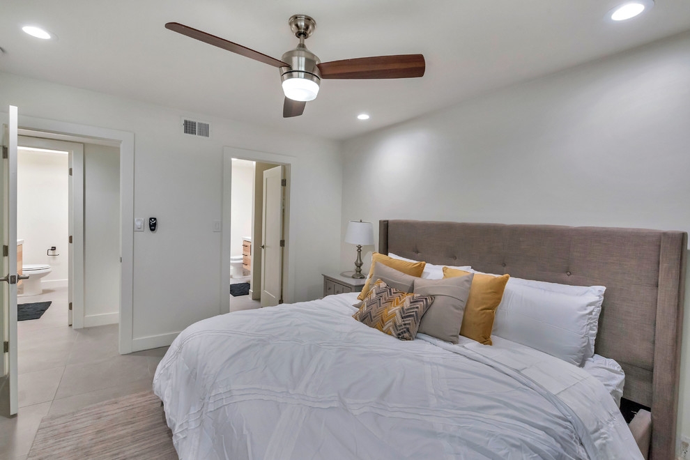 Medium sized classic master bedroom in Phoenix with white walls, ceramic flooring, no fireplace and grey floors.