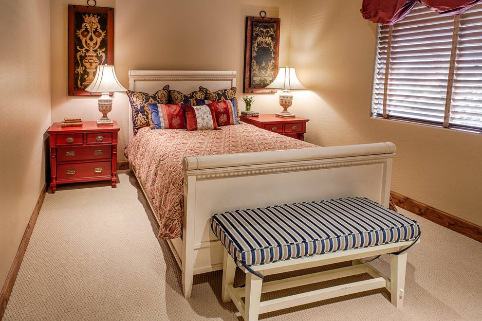 Example of a mid-sized tuscan guest carpeted bedroom design in Phoenix with beige walls and no fireplace