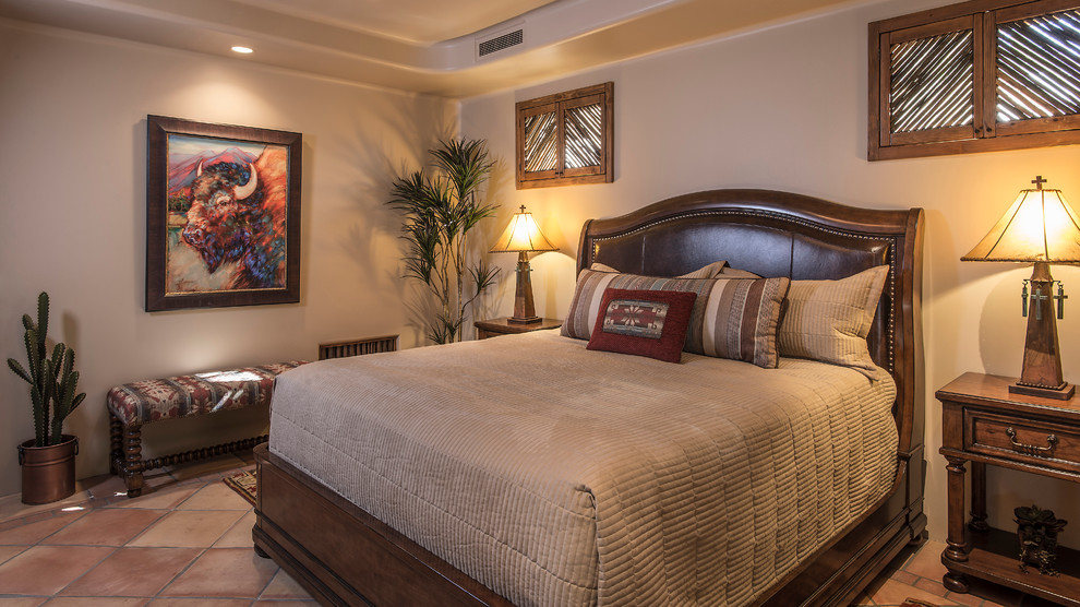 Design ideas for a large guest bedroom in Phoenix with beige walls and carpet.