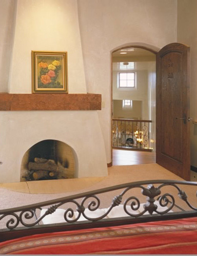 Photo of a medium sized traditional master bedroom in Albuquerque with beige walls, carpet and a standard fireplace.
