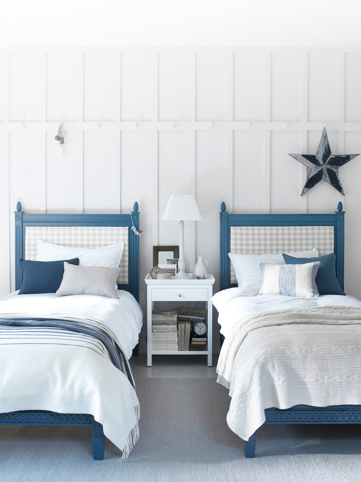 Inspiration for a farmhouse guest bedroom in Belfast with white walls and no fireplace.