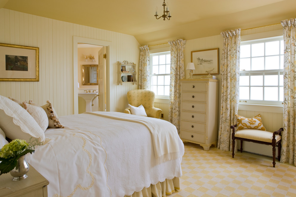Example of an ornate carpeted bedroom design in Boston with yellow walls
