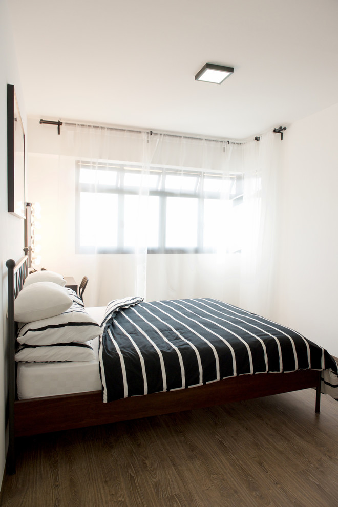 Example of an urban master vinyl floor bedroom design in Singapore with white walls