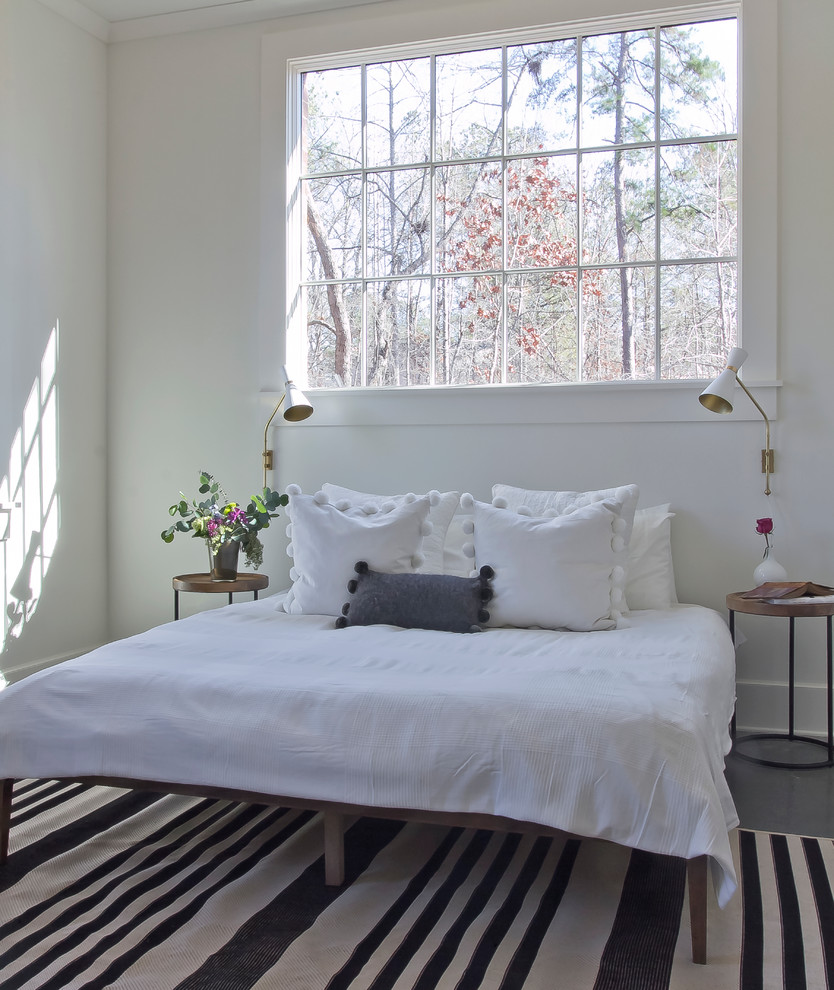 Пример оригинального дизайна: спальня среднего размера на антресоли,: освещение в скандинавском стиле с белыми стенами и бетонным полом без камина