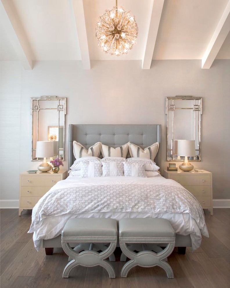 Example of a large transitional master medium tone wood floor and brown floor bedroom design in Austin with green walls